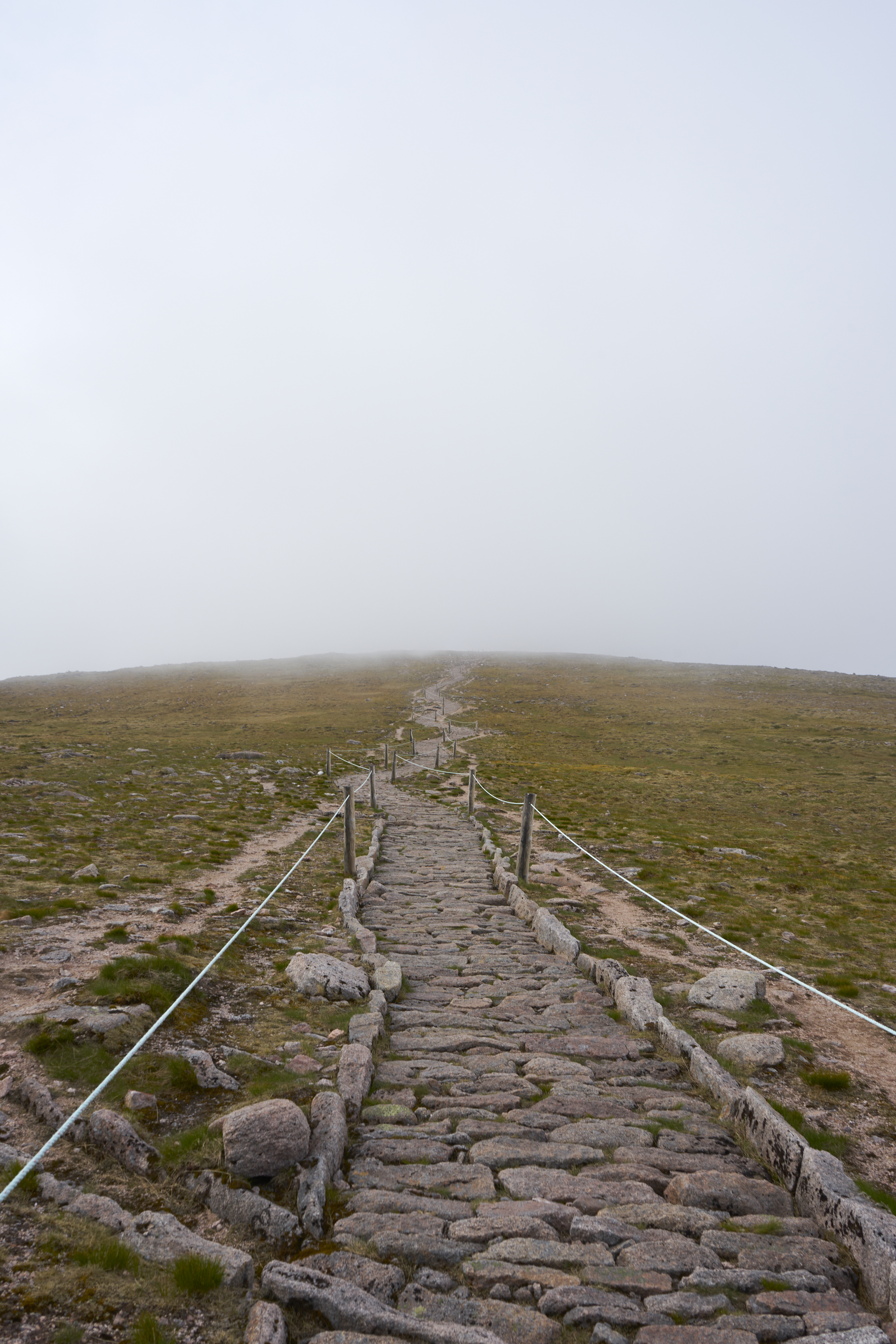 delimited path ascending to cairn gorm through the fog