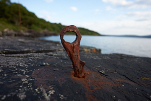 rusty anchor point at sunrise