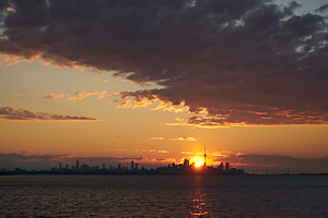 sunrise over toronto skyline from etobicoke